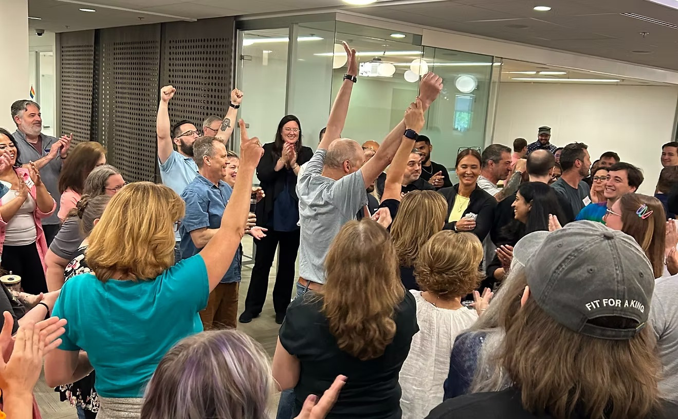 A team celebrating together during an Unscripted Productions session